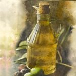 una bottiglia di olio d'oliva in vetro trasparente con tappo di sughero